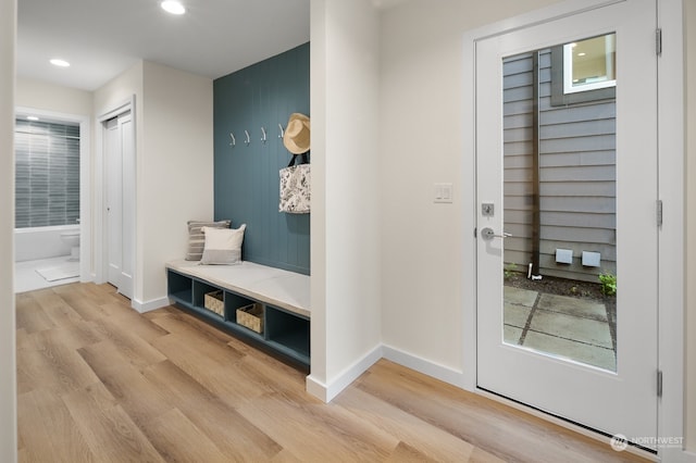 mudroom with light hardwood / wood-style floors