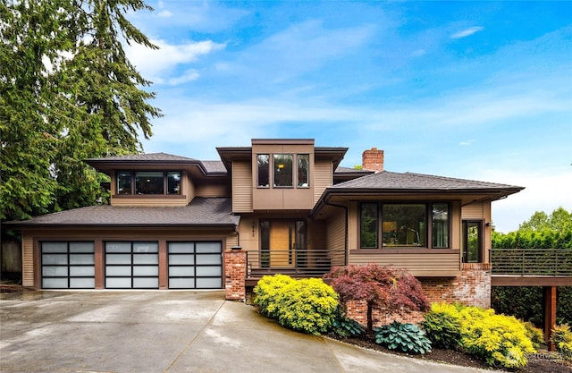 7842 NE 10th St, Medina, WA 98039 - prairie-style house with a chimney, concrete driveway, an attached garage, and brick siding