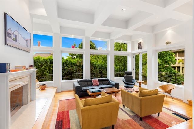 sunroom / solarium featuring beamed ceiling and coffered ceiling