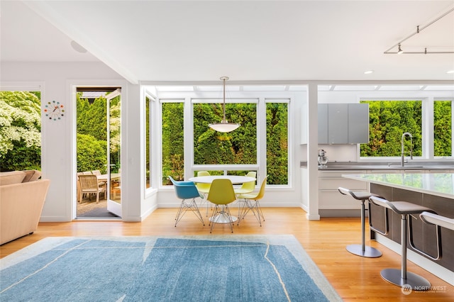 sunroom / solarium with plenty of natural light and sink