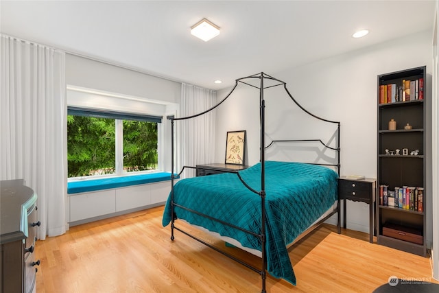 bedroom with wood-type flooring