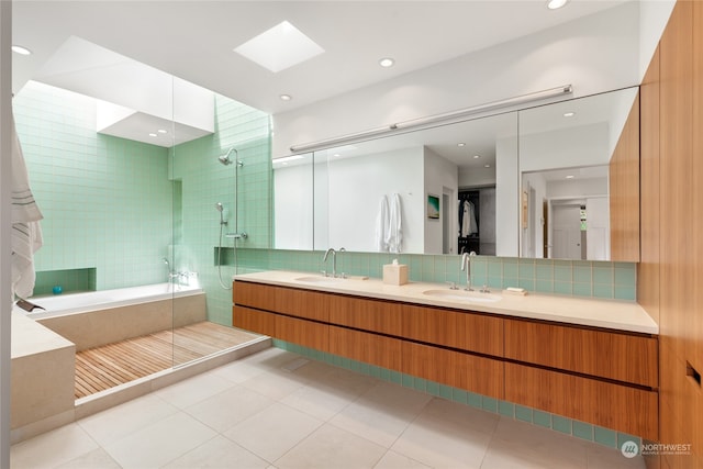 bathroom with separate shower and tub, vanity, tile patterned floors, and backsplash