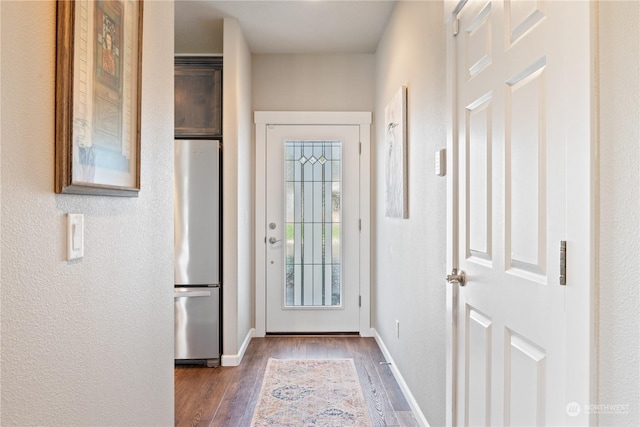 146 Zephyr Dr, Silverlake, WA 98645 - doorway to outside featuring wood finished floors and baseboards