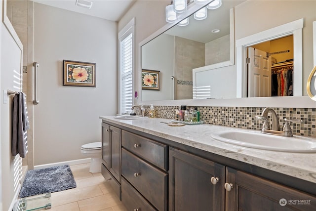 146 Zephyr Dr, Silverlake, WA 98645 - full bathroom with backsplash, double vanity, tile patterned floors, and a spacious closet
