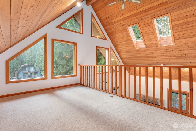 additional living space featuring a wealth of natural light, carpet floors, wood ceiling, and high vaulted ceiling