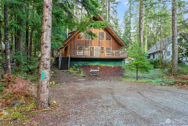 view of front of property featuring a wooden deck