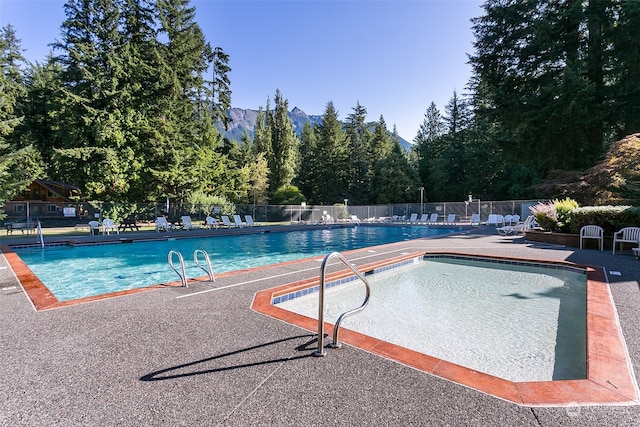 view of pool featuring a patio