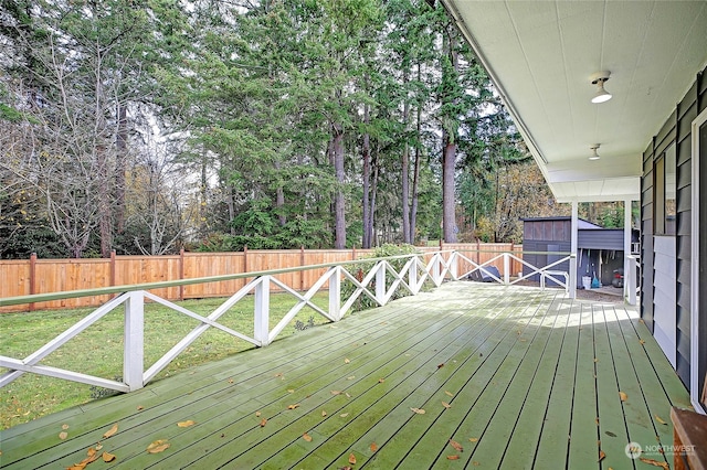 wooden deck with a yard