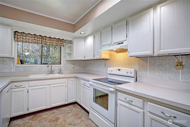 kitchen with decorative backsplash, white appliances, crown molding, sink, and white cabinetry