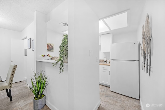 interior space with a textured ceiling