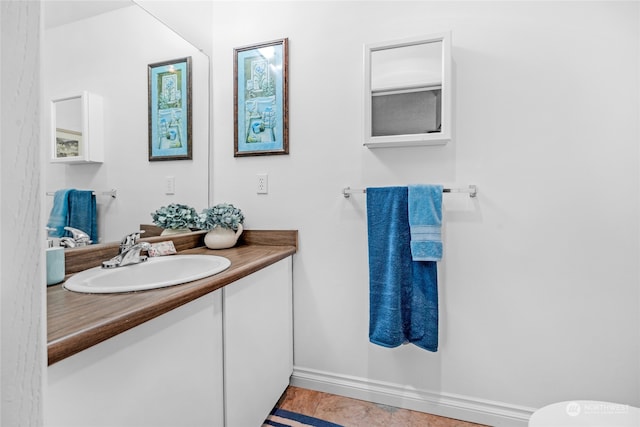 bathroom with tile patterned floors and vanity