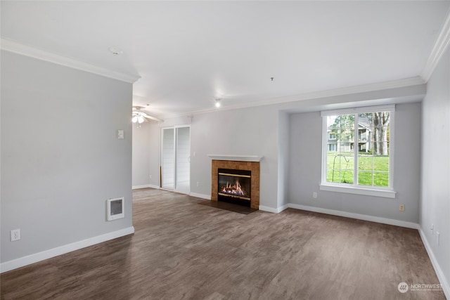 unfurnished living room with a fireplace, hardwood / wood-style flooring, ceiling fan, and crown molding