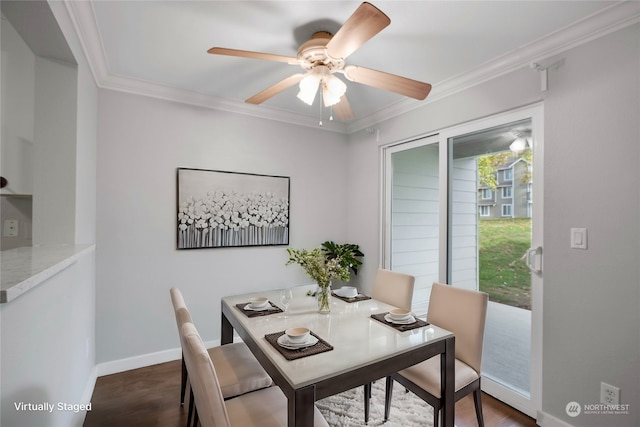 dining room with ceiling fan, dark hardwood / wood-style floors, and ornamental molding