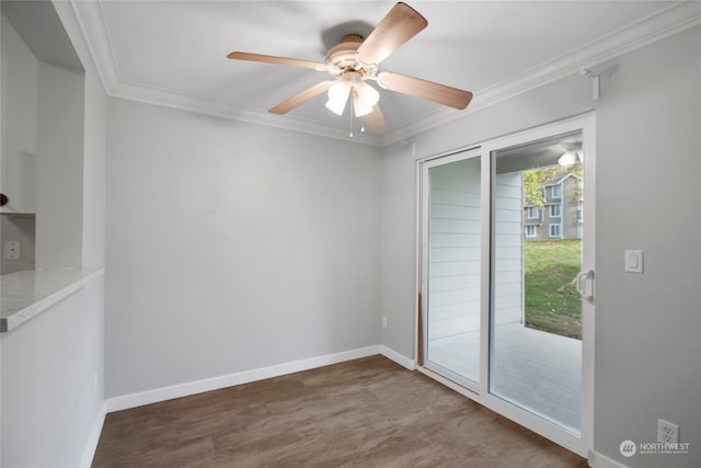 spare room featuring ceiling fan, wood-type flooring, and ornamental molding