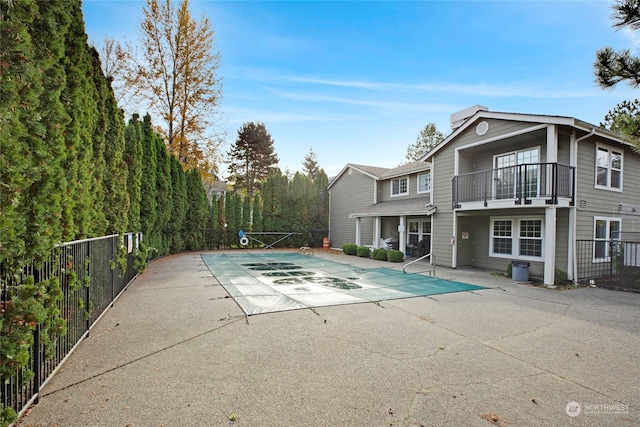 view of swimming pool with a patio area