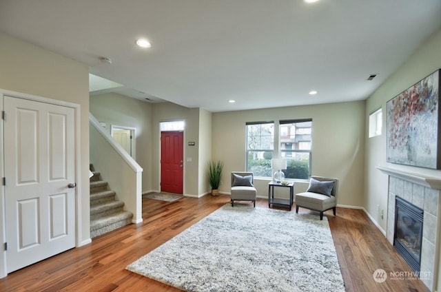 sitting room featuring a fireplace and wood-type flooring