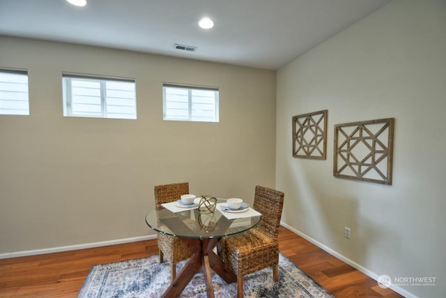 dining area with hardwood / wood-style floors