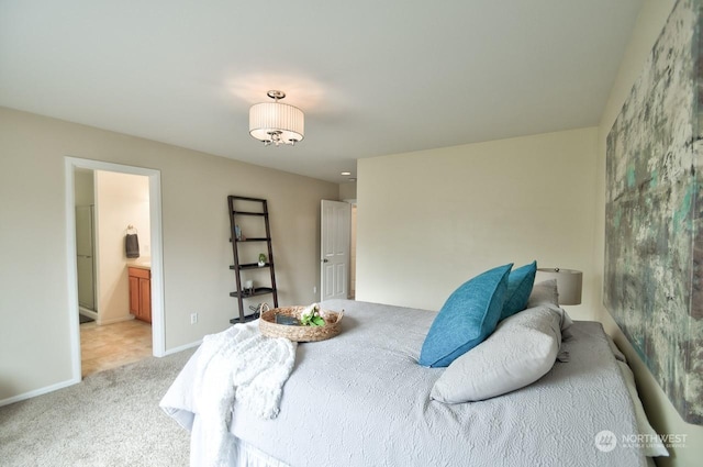 carpeted bedroom with ensuite bath