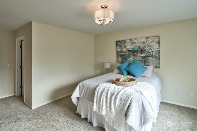 bedroom featuring light colored carpet