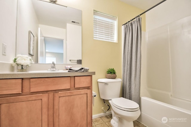 full bathroom featuring vanity, shower / tub combo with curtain, tile patterned floors, and toilet