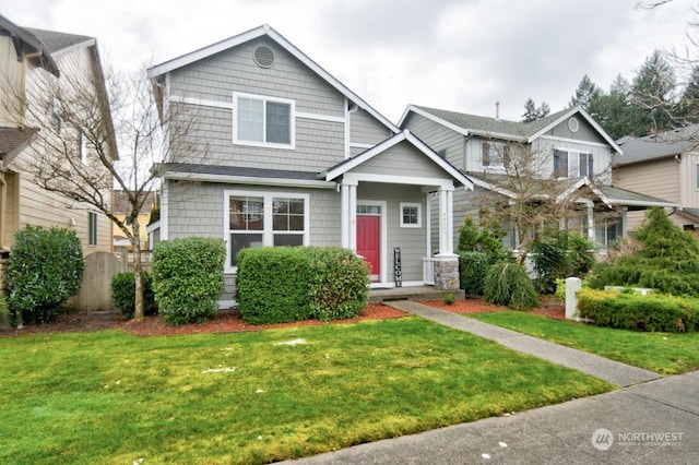 craftsman house with a front lawn