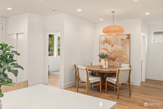 dining space featuring light hardwood / wood-style floors