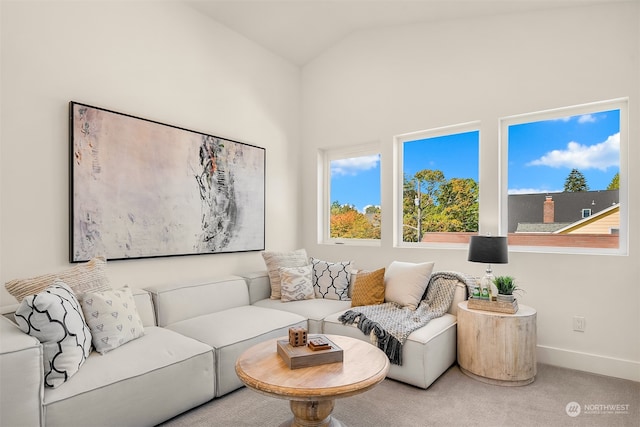 living room featuring carpet flooring and vaulted ceiling