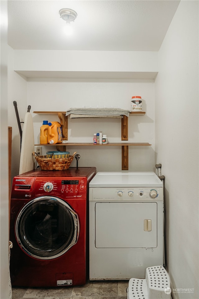 laundry room featuring washing machine and dryer