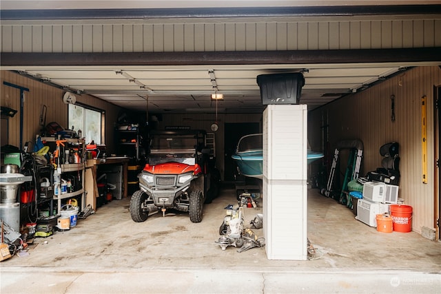 garage featuring wooden walls