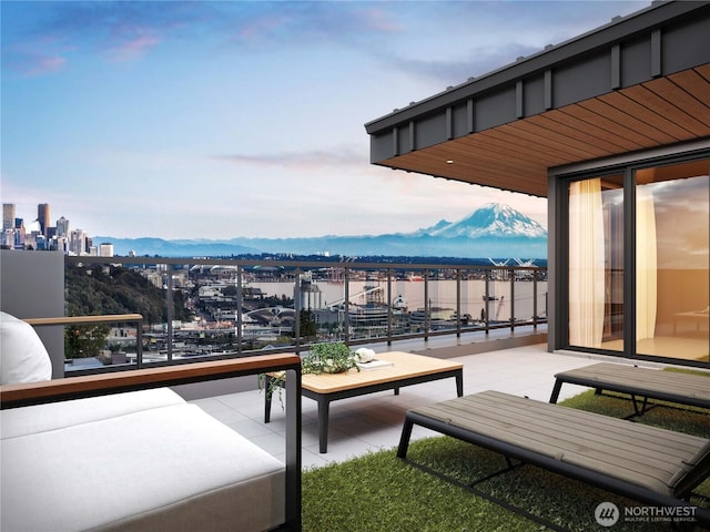 balcony featuring a view of city and a mountain view