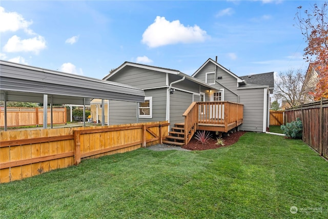 back of house with a deck and a lawn