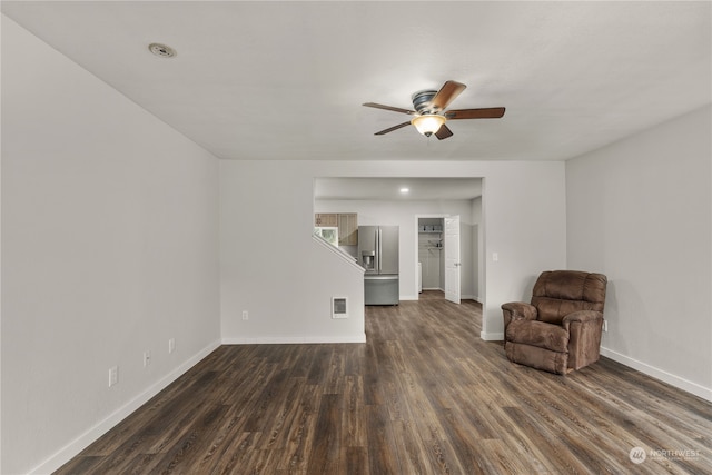 unfurnished room featuring ceiling fan and dark hardwood / wood-style flooring