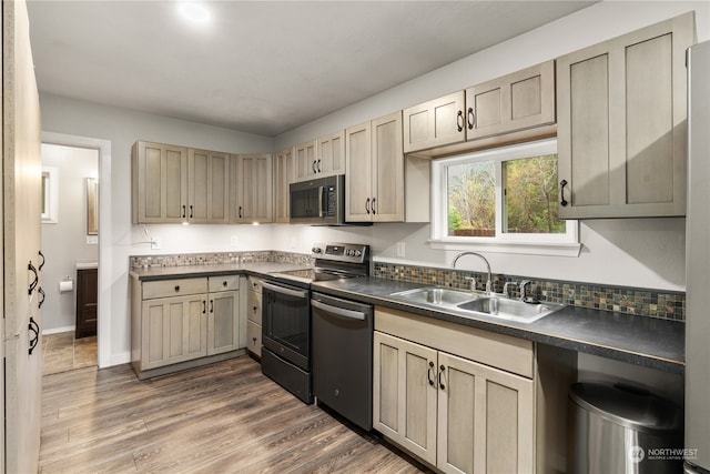 kitchen with sink, stainless steel appliances, and dark hardwood / wood-style floors