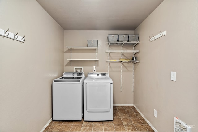 laundry area with washing machine and clothes dryer