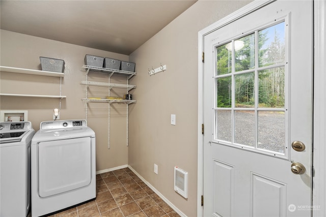 clothes washing area with washer and dryer