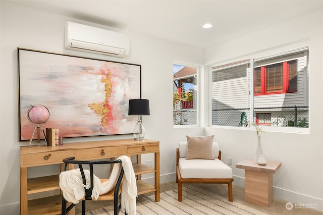 sitting room featuring a wall mounted AC