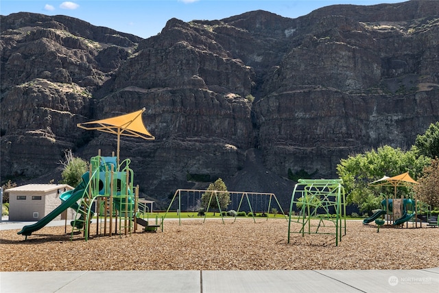 community jungle gym with a mountain view