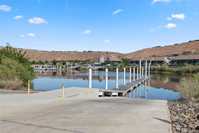 dock area with a water and mountain view