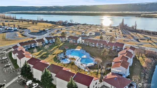 aerial view with a water view and a residential view