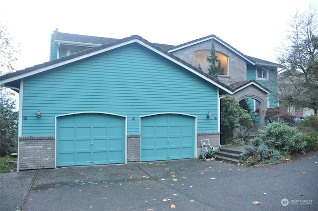 view of front of property with a garage