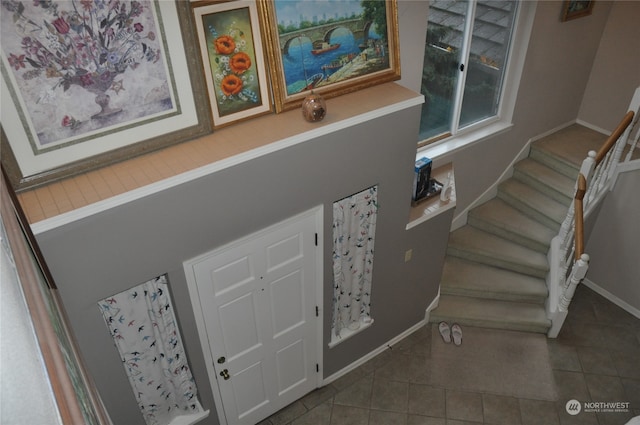 stairway featuring tile patterned floors