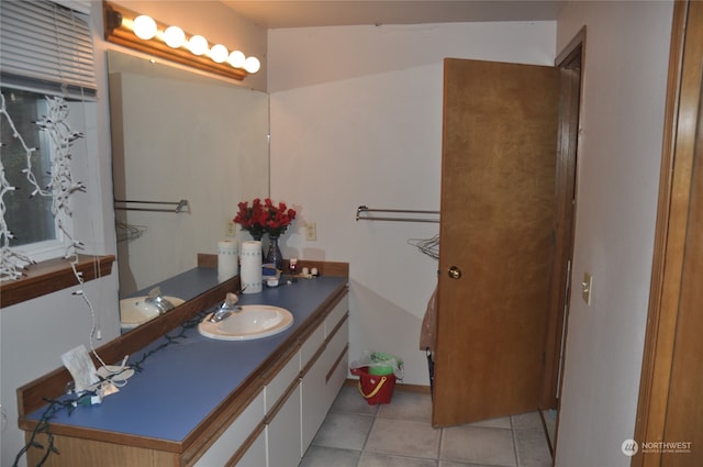 bathroom with tile patterned flooring and vanity