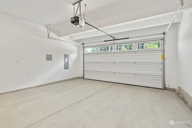 garage featuring a garage door opener and electric panel