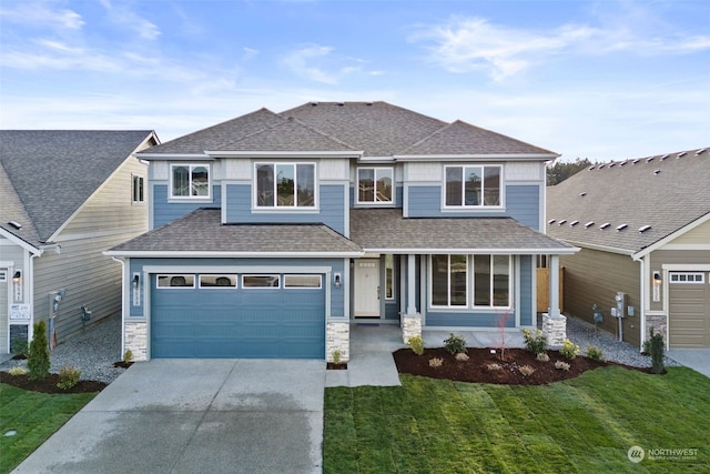 view of front facade featuring a garage and a front yard