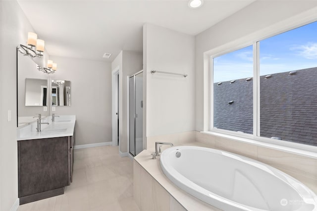 bathroom featuring vanity and separate shower and tub