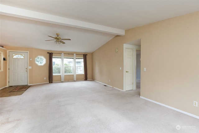 unfurnished living room featuring ceiling fan, light colored carpet, and vaulted ceiling with beams