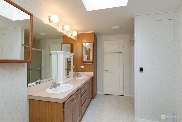 bathroom featuring walk in shower, vanity, and a skylight