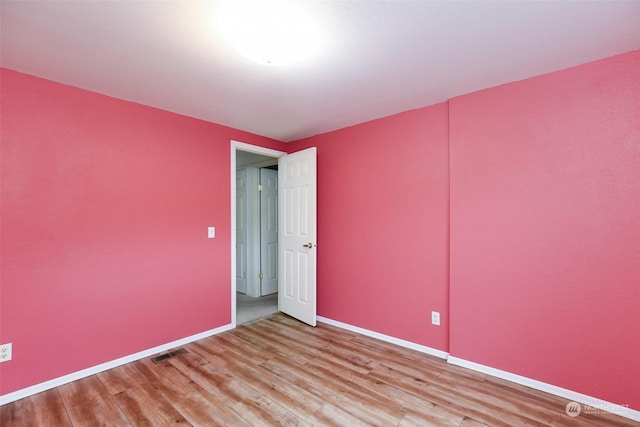 spare room featuring hardwood / wood-style flooring