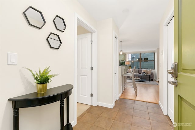 hallway featuring light tile patterned flooring