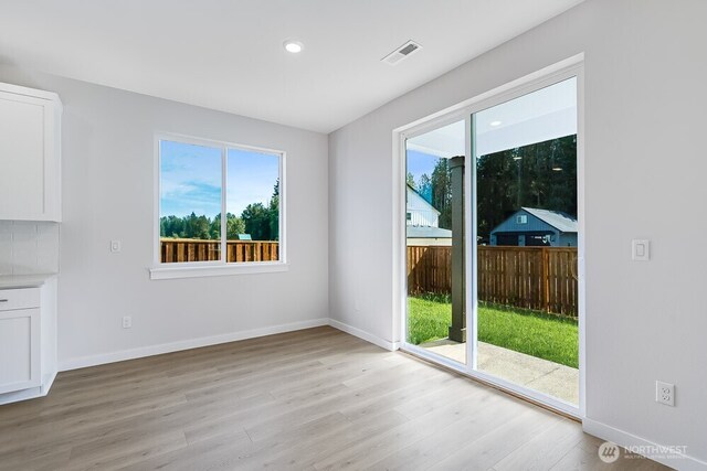 3313 SE 12th Ave, Battle Ground, WA 98604 - unfurnished dining area with light wood-style floors and recessed lighting